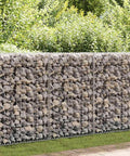 Heavy Duty Galvanized Gabion Wall Basket 236 X 11.8 X 59 Inch filled with rocks, serving as a retaining wall for landscaping.