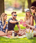 Group enjoying outdoor picnic with 100 Pack 1 Oz Popcorn Bags For Popcorn Machines And Movie Nights, Food Grade Paper Bags For Individual Servings.