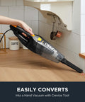 Person using Blaze 3 In 1 Stick Vacuum Cleaner With Powerful Suction Lightweight Four Pound Handheld For Quick Cleanups On The Go Onboard Crevice Tool Great For Hard Floors And Pet Hair to clean crumbs on a countertop.