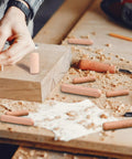 Top Shelf Wooden Dowel Pins Featuring Fluted Hardwood Rods For Furniture Repairs And Craft Builds Supplies Ninety Pieces in use on woodworking surface.