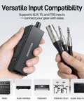 Wired In-Ear Monitor Amplifier With XLR And TRS Inputs held in hand, showing versatile connectivity for audio setups.