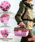 Person carrying All In One Trout Fishing Tackle Kit with pink box on a lakeside trail, compartments visible with secure lock.