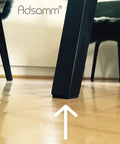 Heavy Duty Self Adhesive Felt Pads Black Square Stick On Furniture Glides under a chair leg protecting the floor.