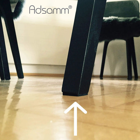 Heavy Duty Self Adhesive Felt Pads Black Square Stick On Furniture Glides under a chair leg protecting the floor.