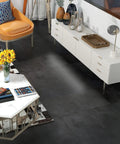 Living room with Retro Peel And Stick Floor Tiles 16 Pack 12x12 Inch Vinyl Concrete Gray Waterproof, orange chair and white cabinet