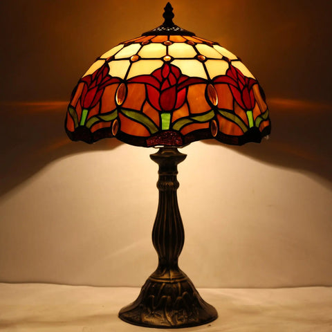 Tiffany Style Stained Glass Tulip Table Lamp for Bedroom and Living Room, 12 Inch Shade, Antique Green Bronze Base lit up.