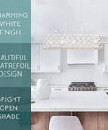 Sutton 35-Inch Five-Light Modern Island Light With Open Design Quatrefoil Metal Shade In Rustic Antique White Finish above kitchen