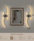 Cordless Rechargeable Wall Sconces Set Of 2 With Dimmable LED Mood Lighting, Remote Control shown next to artwork