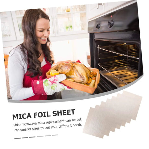 Woman with roast turkey near oven highlighting 10 Pack 150x120mm Mica Plate Sheets For Microwave Heat Insulation And Fireproofing