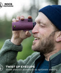Ultra Portable 10x32 Waterproof Monocular For Bird Watching And Birding Adventures With Fully Coated Optics Bak4 Prism Oversized Focus Wheel And A 333 Ft Field Of View At 1000 Yards Lightweight 8 Oz. man using purple monocular with twist-up eyecups outdoors