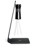 Magnetic WDT Tool for Espresso Puck Prep with 120 degree adjustable angle, includes 0.25mm and 0.40mm needles, shown on stand.