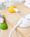 6 Pack Desk Cable Organizer Clips For Wire Management Adhesive Cord Holders installed on desk holding USB cables