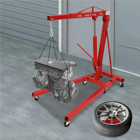 Heavy Duty Carbon Steel Engine Hoist With Smooth Hydraulic Lifting System And Foldable Stand Frame For No Drama Backyard Mechanic Garage Tool Optimization lifting an engine in a garage.