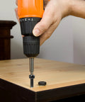 M6 Button Head Socket Cap Screws being installed on wood using electric drill in hardware application.
