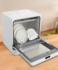 Big Time Portable Countertop Dishwasher Compact Mini Automatic Washing Machine with plates in stainless steel rack on a wooden countertop.