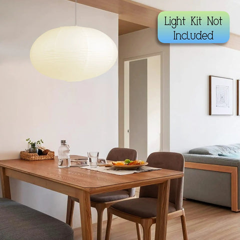 Oval Crepe Paper Lanterns 22 Inch Two Pack For Indoor Ceiling Decor hanging above dining table in modern room.