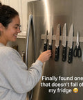 16 Inch Stainless Steel Magnetic Knife Bar for Kitchen Storage and Home Organization, holding knives on refrigerator