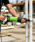 Person using 900W Reciprocating Saw With Variable Speed And LED Work Light on PVC pipes at construction site