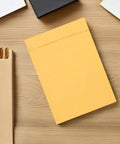 Kraft Paper Bubble Mailers 100 Pack Padded Envelopes 120x160mm Self Seal Waterproof Shipping Bags on a wooden desk