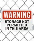 Heavy Duty Warning Sign For No Storage Zones Built Tough As Nails With Smooth Rounded Edges For Safe Handling Made From Durable Recyclable Plastic That Handles Indoor Warehouse Jobs And Outdoor Weather Like A Pro Delivering Clear Safety Alerts Daily mounted on chain link fence.