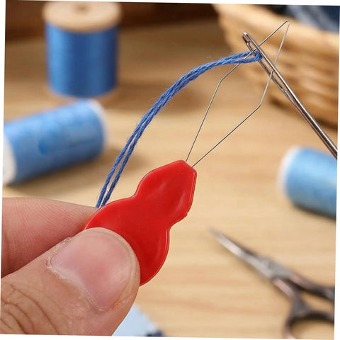Lightweight Embroidery Needle Threader Kit with Gourd Shaped Plastic and Metal Tools 100 Pack Portable Threading Tool for Hand Sewing and Sewing Machines Easy Peasy Fast Versatile for Embroidery Crafts and DIY Projects, red plastic threader in use