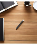 Plastic Bearing Roller Pinch Feed Shaft For Barcode Label Printer Replacement Part on a wooden desk with notebooks and coffee