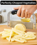 Front view of Nur Essentials crinkle cutter and waffle fry cutter, stainless steel blades, black handle, slicing fries