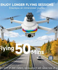 Dual Camera 4K GPS Drone With Built In Five Point Five Inch Screen On Controller, flying over a scenic road with autumn trees.