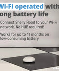Wireless Flood Sensor With Temperature Measurement For Home Automation on a tile floor, compact white design, long battery life