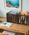 Wood Storage Bin Cube Crate With Handles Rustic Brown Decorative Box Stackable Shelf Basket Organizer For Closet And Bookcase 12 By 12 By 11 Inches Easy Assembly, filled with books and toys on a desk.