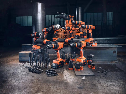 Tough As Nails Badass Cordless Impact Drill With Two Speed Settings And Full Metal Gearbox For Masonry Stone Metal Up To 13 Mm Includes Rugged Storage Case And QuickIN Battery System, arranged with various accessories.