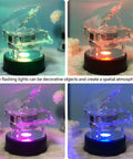 Fieifi Motorized Rotating Led Light Display Base For Crystals And Glass Art with a crystal piano figurine, colorful LED lights, and 4.75 inch diameter.