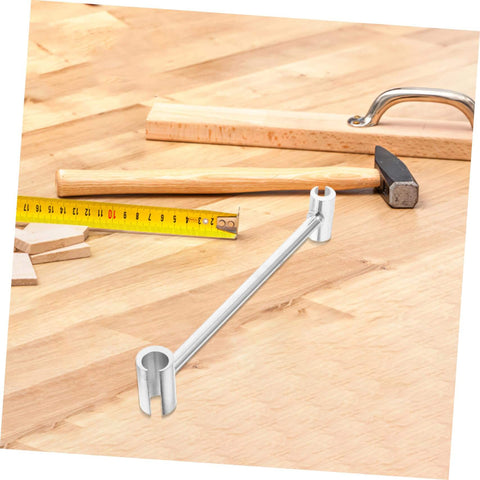 Adjustable Hinge Wrench Dual Spanner Tool for Easy Hinge Adjustments on wooden surface with tools.