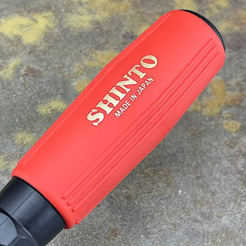 Close-up of the heavy duty rubber grip on a Japanese Rasp And Sanding Block Quick Swap Blades tool, showing logo.