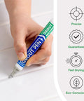 Hand using Light Grey Grout Pen For Tile Touch Up Waterproof Marker Narrow 5mm 2 Pack on white tile grout