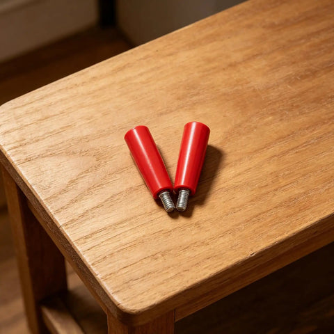 Durable 2-Piece M10x80 Revolving Crank Handle For Lathe And Milling Machines with red bakelite grips on wooden table.
