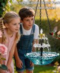 Children observing Solar Cascade Hanging Bird Bath Fountain With Auto Pump in garden, attracting hummingbird.