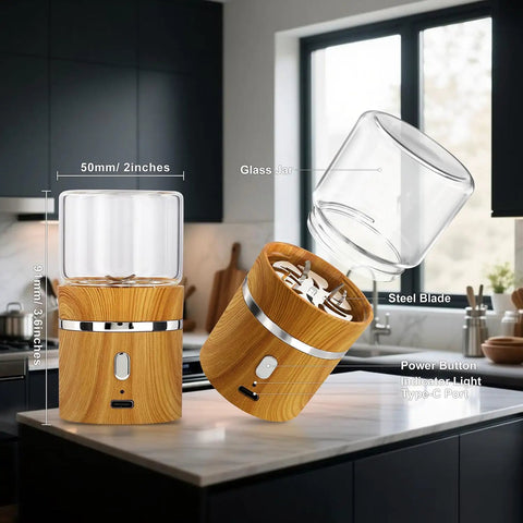 Compact Electric Herb Grinder With Dual 50ml Glass Jars 2in By 3.5in Portable Spice Grinder and components on kitchen counter