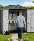 Person walking into Metal Garden Shed 6x4 Outdoor Storage With Lockable Doors, Adjustable Shelves, And Ventilation, Weatherproof.