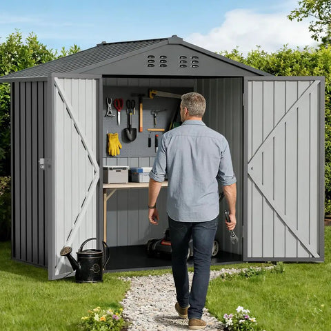Person walking into Metal Garden Shed 6x4 Outdoor Storage With Lockable Doors, Adjustable Shelves, And Ventilation, Weatherproof.