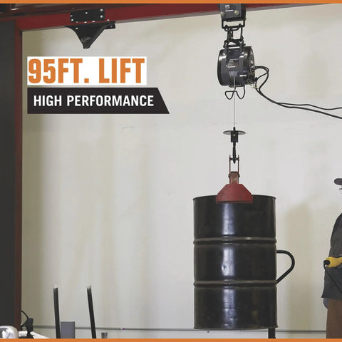 Bannon Compact Electric Cable Hoist 1100 Lb Capacity 95ft Lift lifting a black drum with galvanized rope and saddle hook.