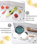 Heavy-Duty Stainless Steel Sink Grid Protectors For Single Bowl Kitchen Sinks, Center Drain Design with vegetables and dishes