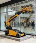 Badass Electric Glass Vacuum Lifter Robot For Oversized Panel Mounting In Facade Construction And Industrial Material Handling Smooth Operator Heavy Rigs servicing large glass panels in a shopping mall.