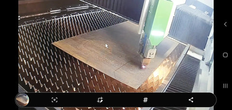 Laser cutting machine creating Four Pack AR500 Laser Cut Steel Shooting Target Gongs, Three-Inch By Quarter-Inch.