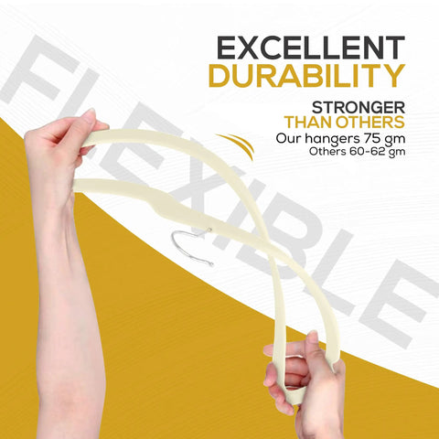 Hand demonstrating the flexibility and durability of 50 Pack Ultra Slim Velvet Closet Hangers Top Shelf Non Slip Felt Coat Jacket Dress Organizers.