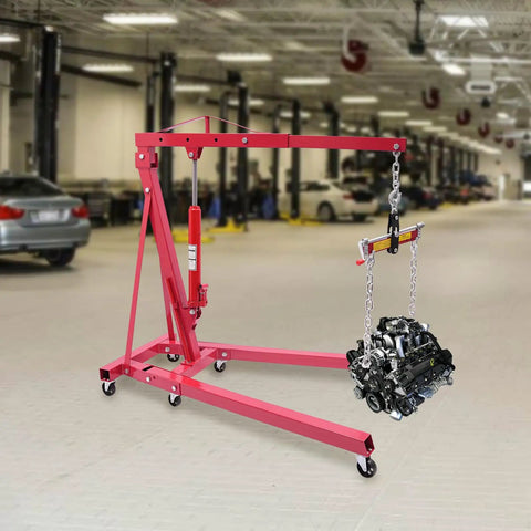 Heavy Duty Folding Hydraulic Engine Hoist Stand Built With Hella Tough Carbon Steel lifting an engine in a garage.