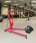 Heavy Duty 2 Ton Hydraulic Engine Hoist With Adjustable Boom And Smooth Rolling Casters, Folding Shop Cherry Picker Crane Rated For 4400 Lbs in garage.