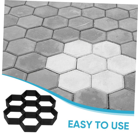Hexagon Concrete Paver Mold For DIY Gardens And Patios, Reusable Plastic Tile Molds To Create Custom Garden Paths, Walkways And Patio Floors, Size 11.41 X 11.02 X 1.69 In, Durable And Easy To Use showing black plastic mold next to concrete hexagon tiles.