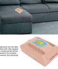 Dual Roller Carpet Sofa Sweeper With Double Action Floor Dust Collector on a couch, compact brush for cleaning pet hair and crumbs.