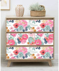Dresser with peel and stick white floral wallpaper featuring pink peonies and eucalyptus for nursery or bedroom boho vibe